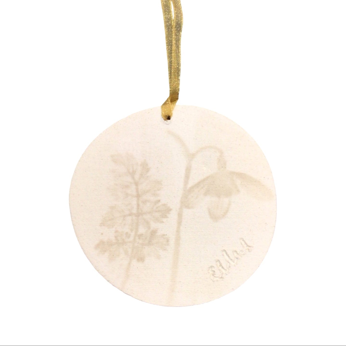 The back of a ceramic hanging decoration.