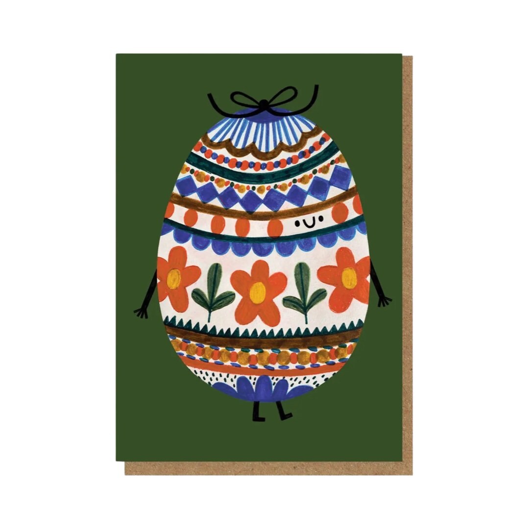 Easter card featuring an illustration of a floral patterned smiling Easter egg on a green background.