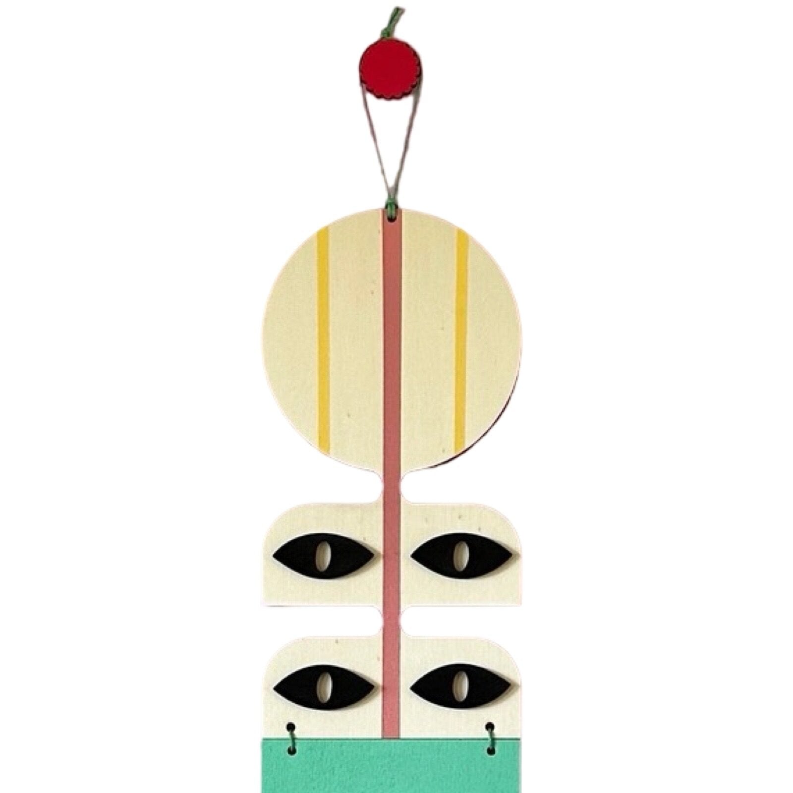 A geometric modern wall art hanging in red, green, black, and white with a waxed cord and wooden beads.