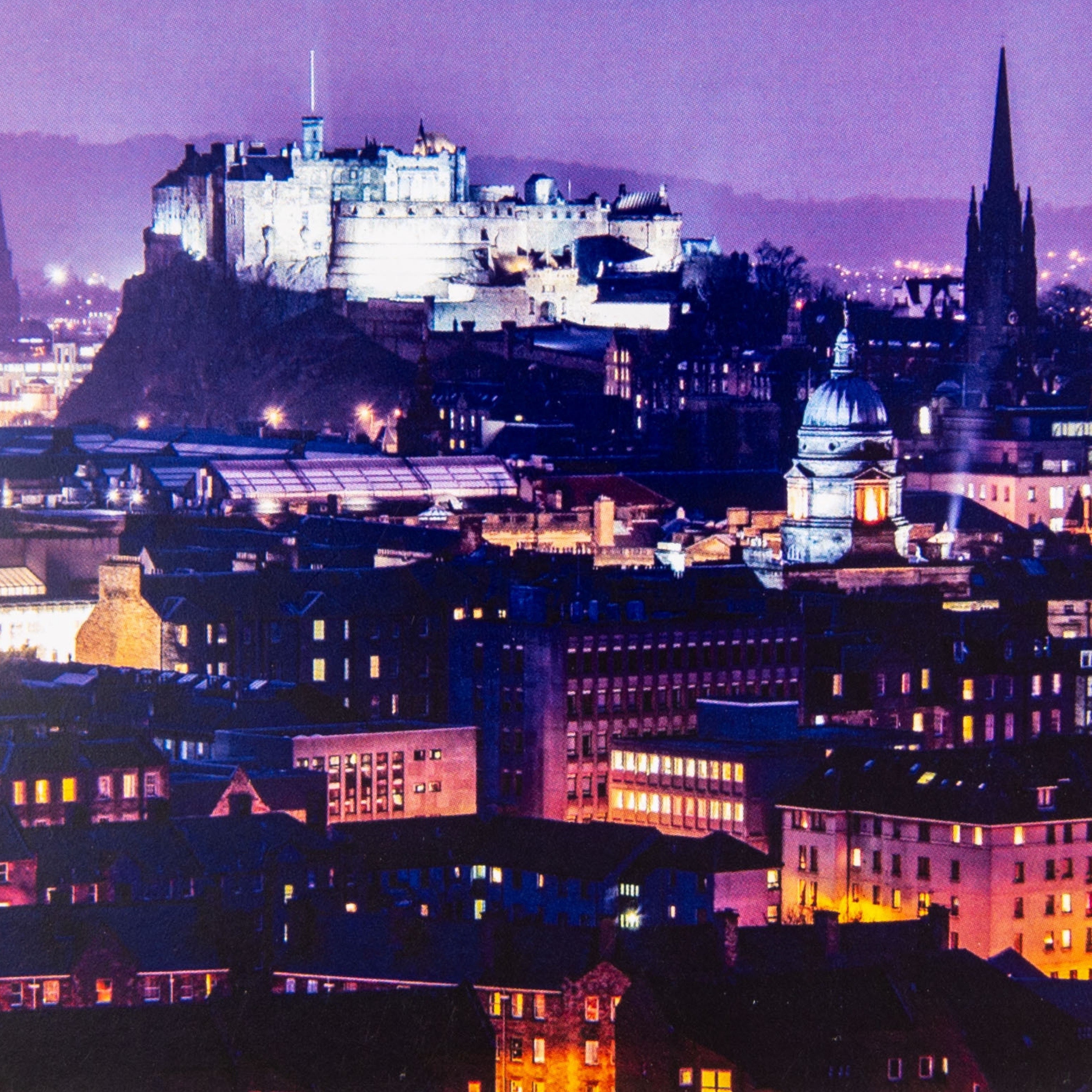 A greeting card featuring a photograph of Edinburgh Castle with the cityscape in the background, printed on the front.