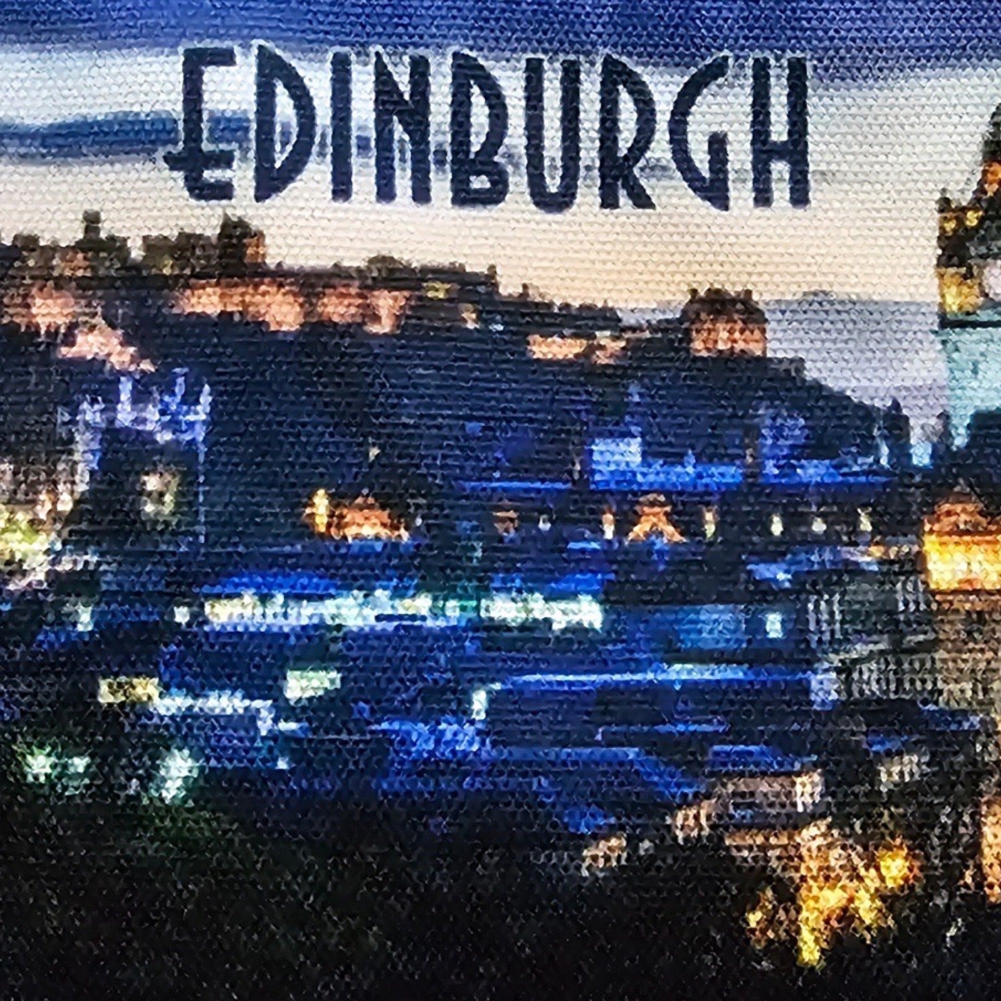 Cityscape of Edinburgh with illuminated buildings and 'Edinburgh' text at the top.