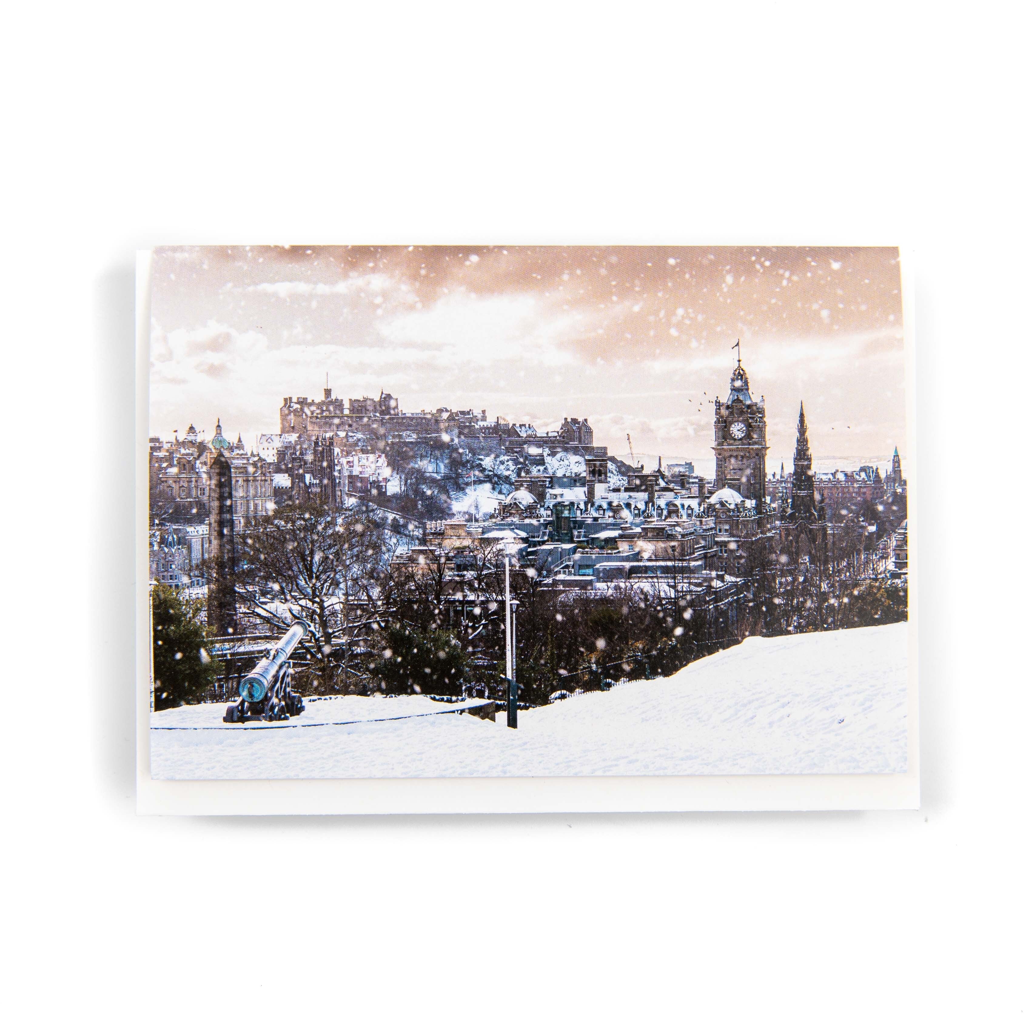 A greeting card featuring a snowy scene of Edinburgh Castle and the cityscape from Calton Hill, designed by Ryan McEwan Photography.