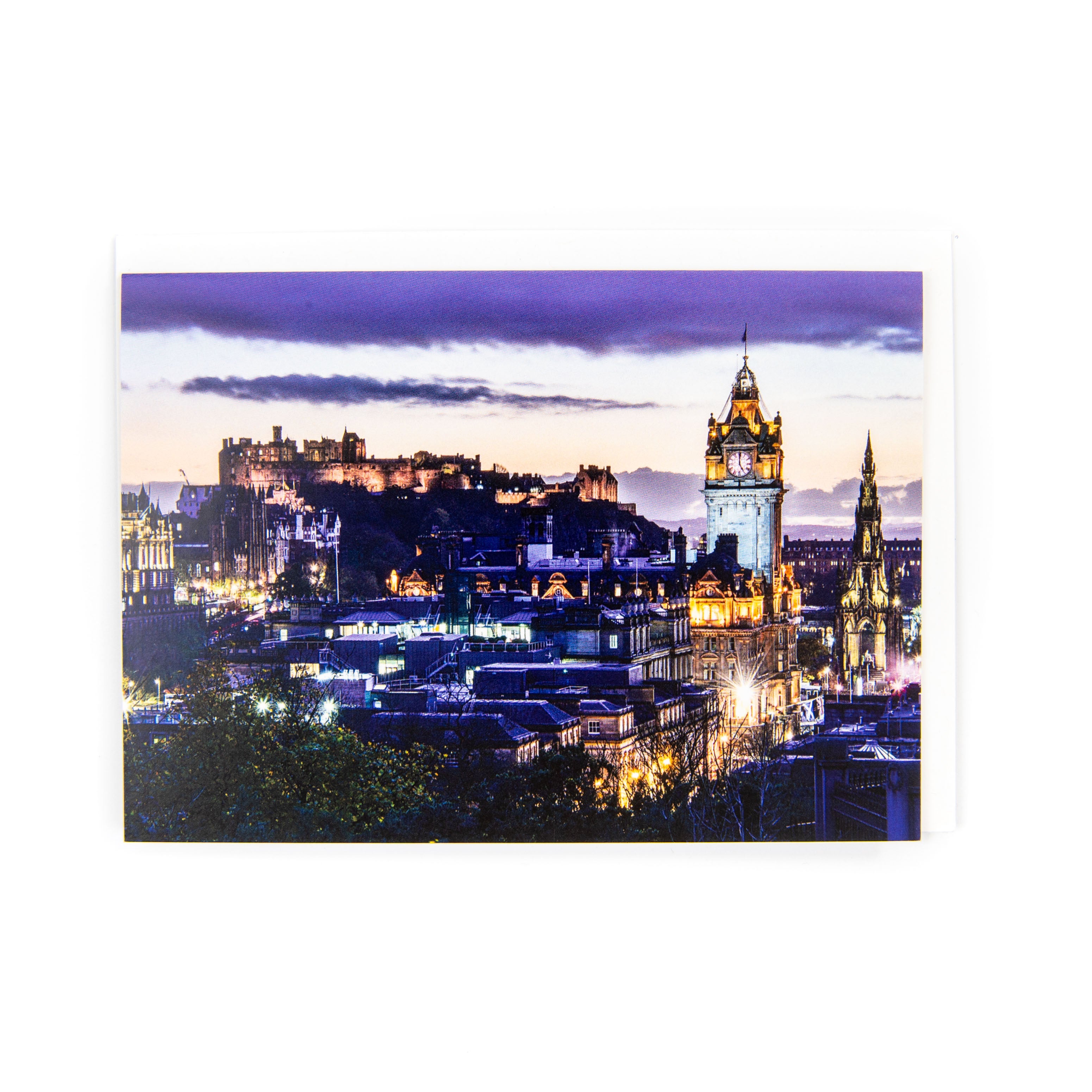 A greeting card featuring a photograph of the Edinburgh skyline at dusk, with a blank interior and a white envelope.