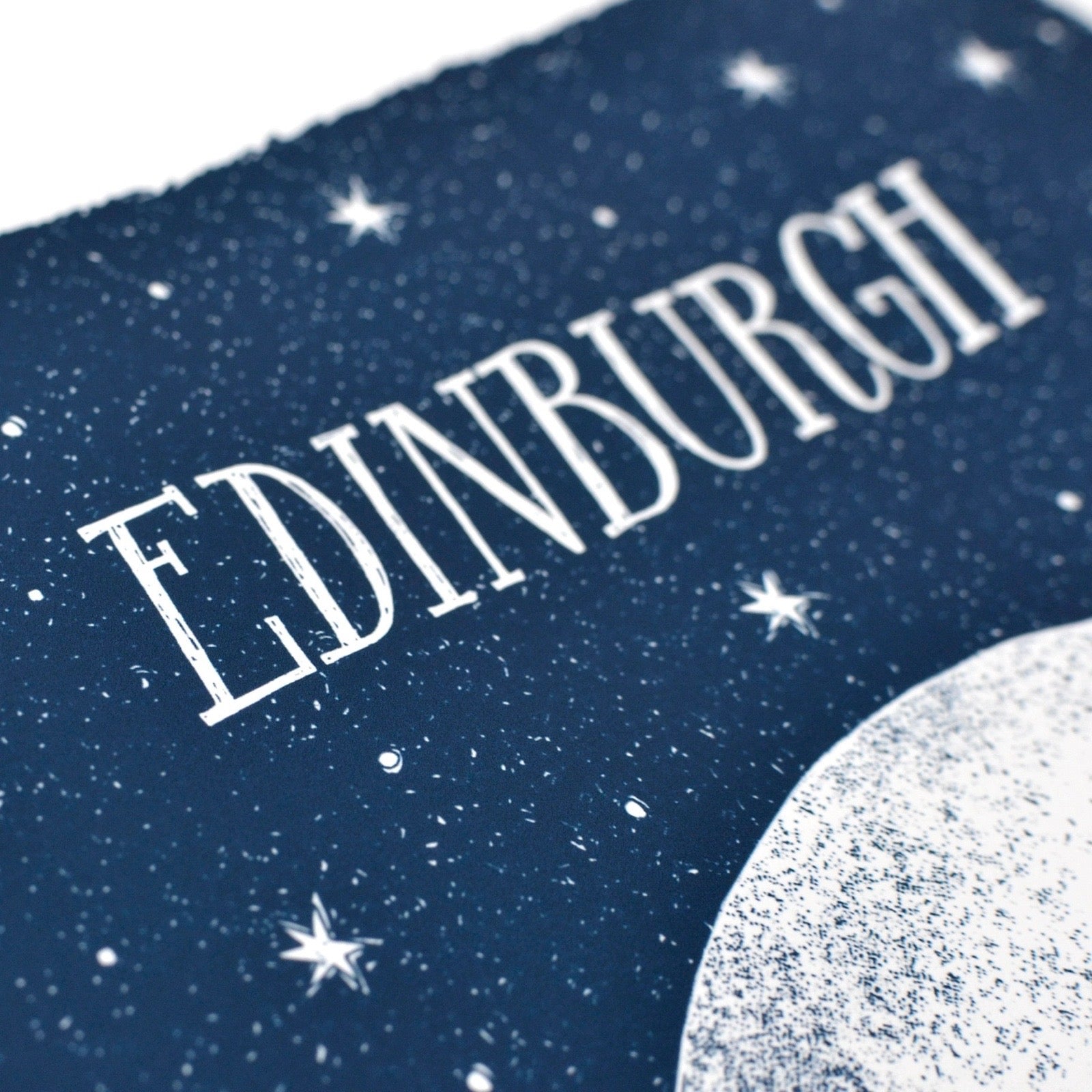 Text 'EDINBURGH' on a starry night sky with a moon.