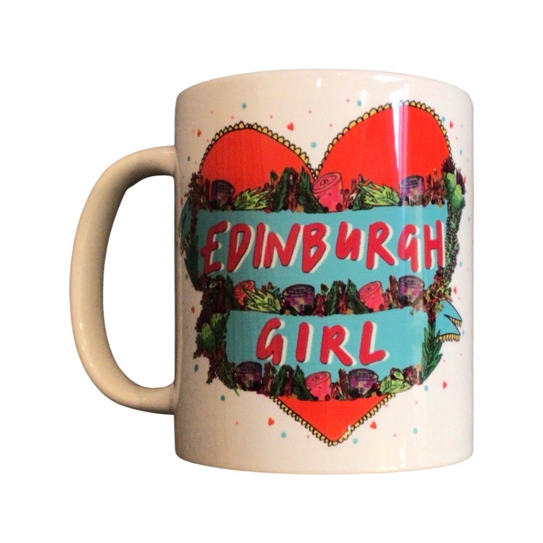 Edinburgh Girl mug featuring the text 'Edinburgh Girl' written inside a blue banner surrounded by flowers inside a big red love heart.