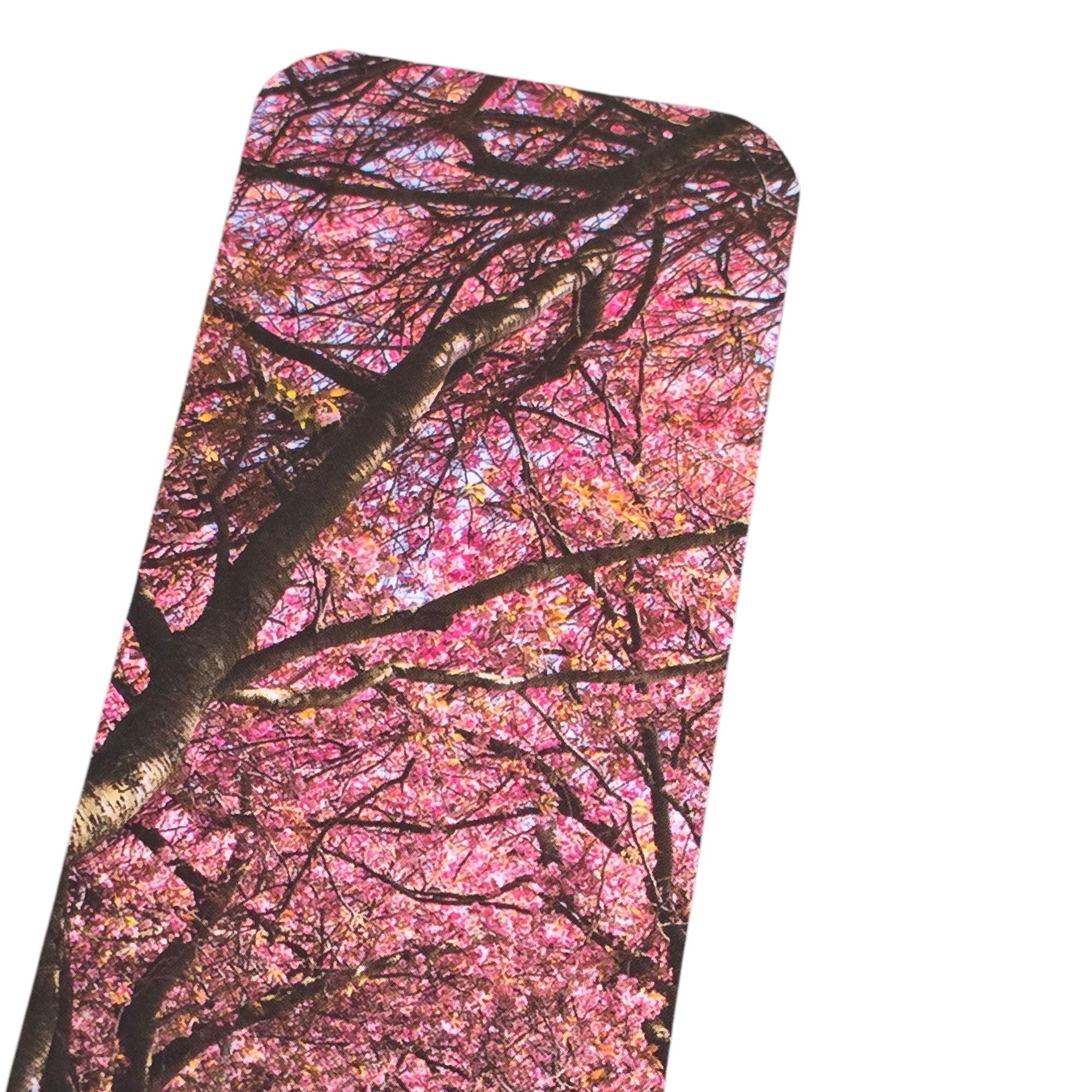 A bookmark with trees and blossom.