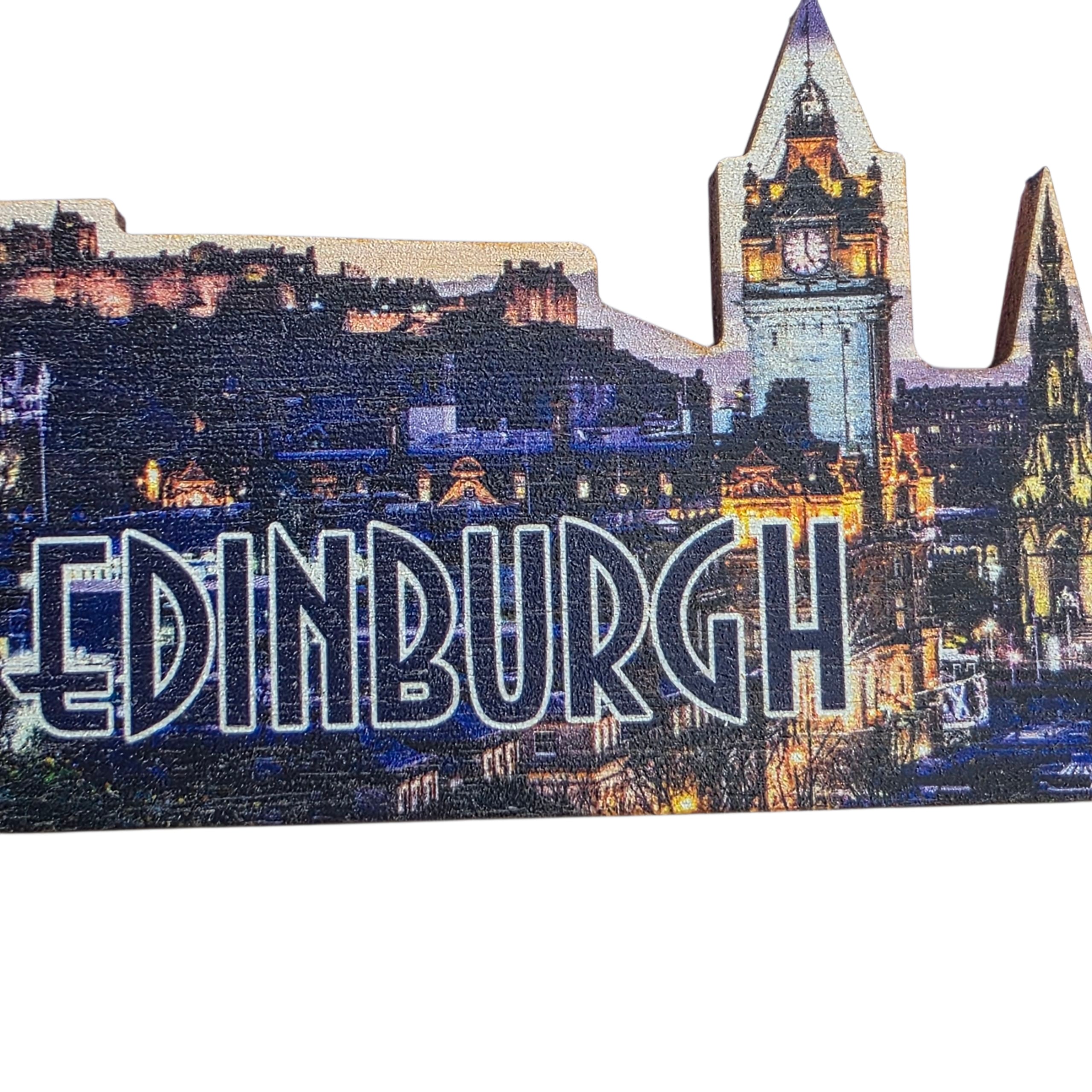 Wooden magnet of Edinburgh cityscape with illuminated clock tower and 'Edinburgh' text.