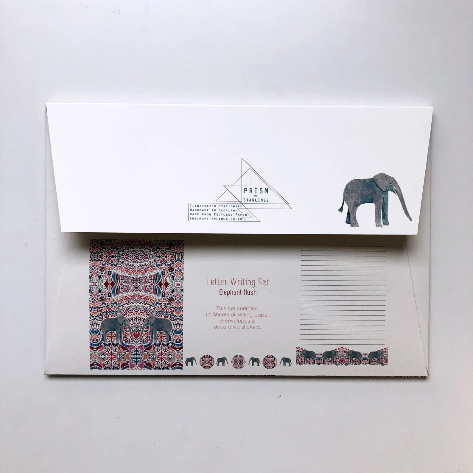 Letter writing set with elephant design on a white background.