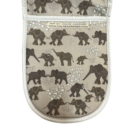 Grey oven gloves featuring dark grey elephants, some blowing water from their trunks.