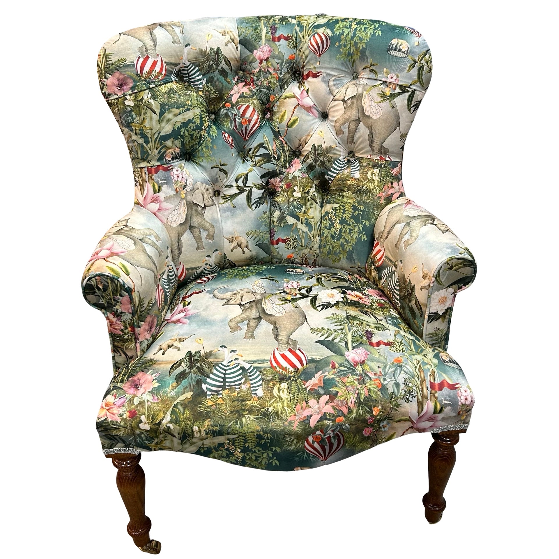 Decorative armchair with a colourful animal print on a white background.