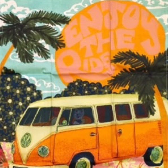 Vintage-style orange van with palm trees and a colorful sky in the background.