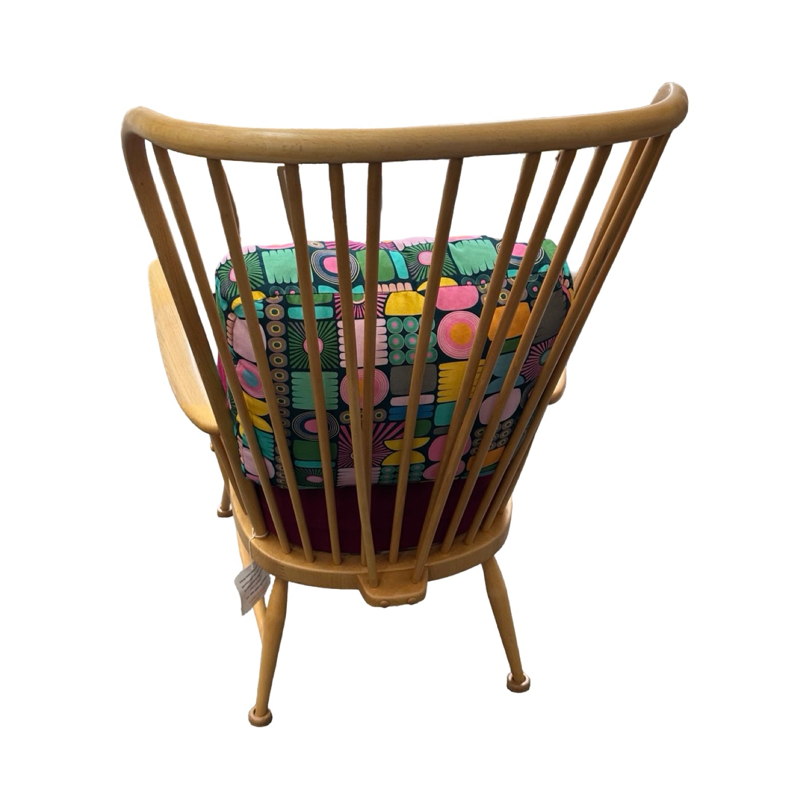 Wooden chair with a colorful cushion on a white background