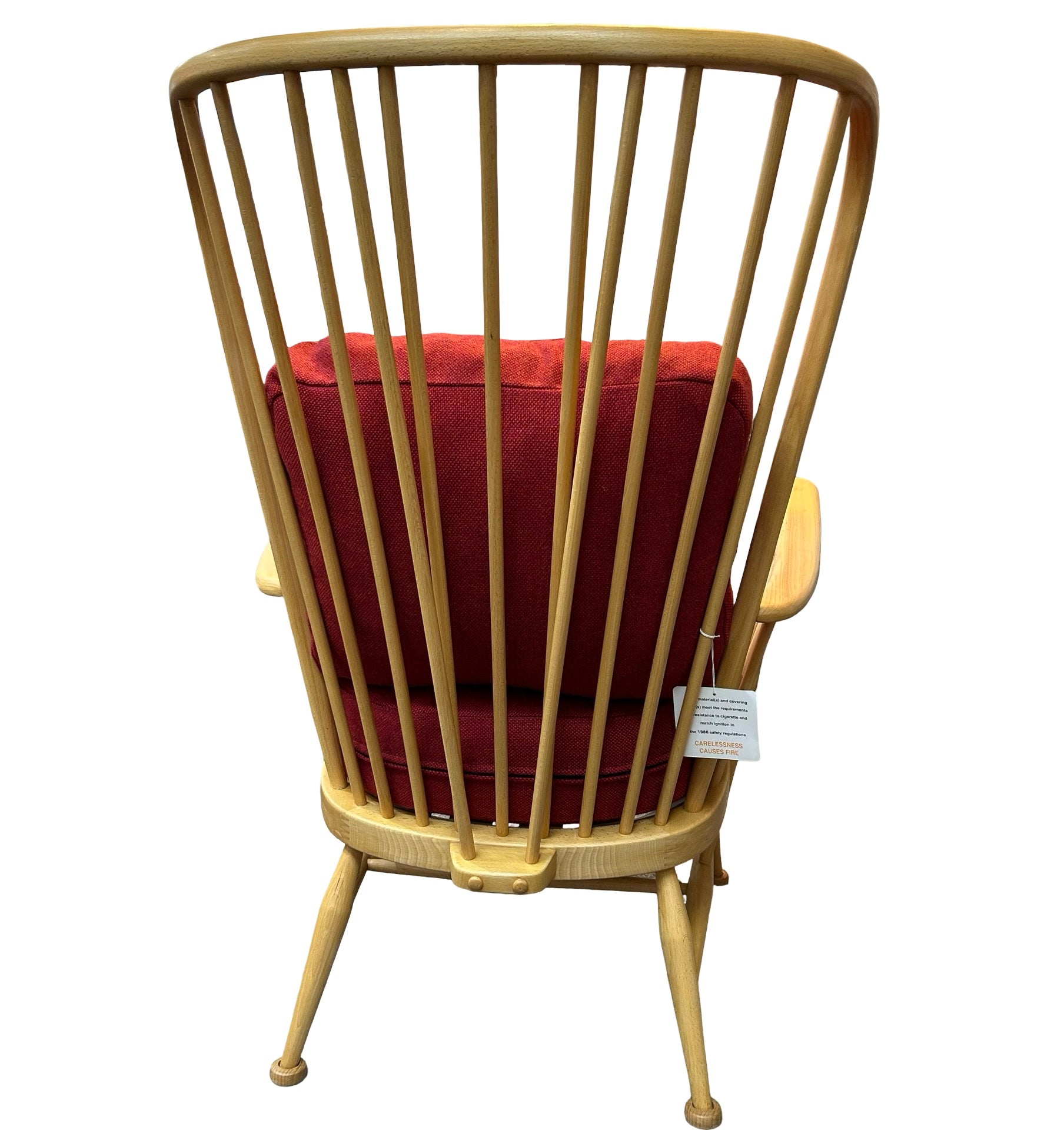 Showing the back of the upcycled Ercol chair with red tweed cushions