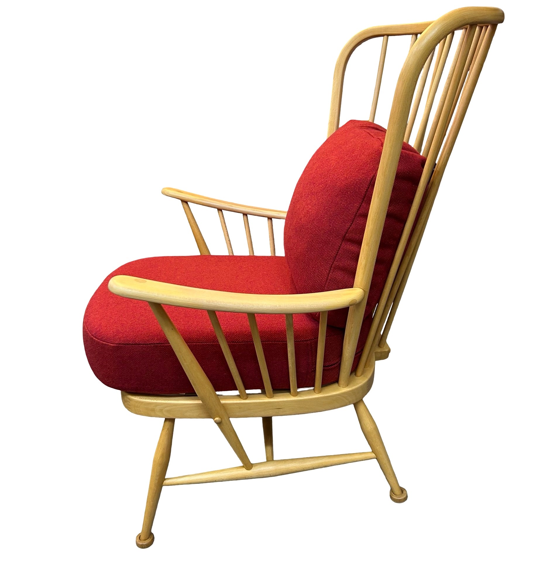 Side view of upcycled Ercol chair with red tweed cushions