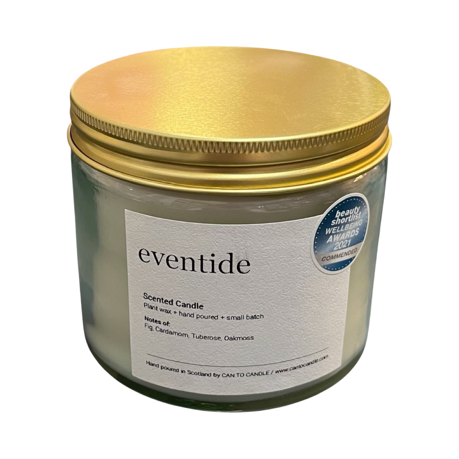 Scented candle with gold lid and 'eventide' label on a white background.