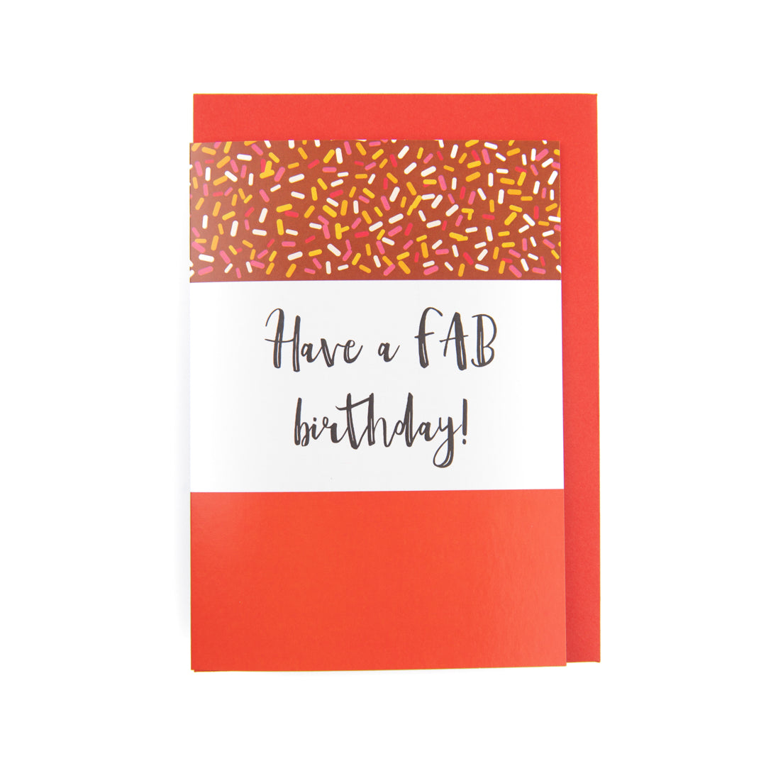 Greeting card with 'Have a FAB birthday!' text and colorful envelope on a white background