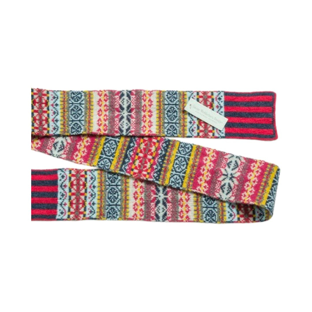 This skinny Fairisle scarf has a raspberry pink, navy and yellow pattern.