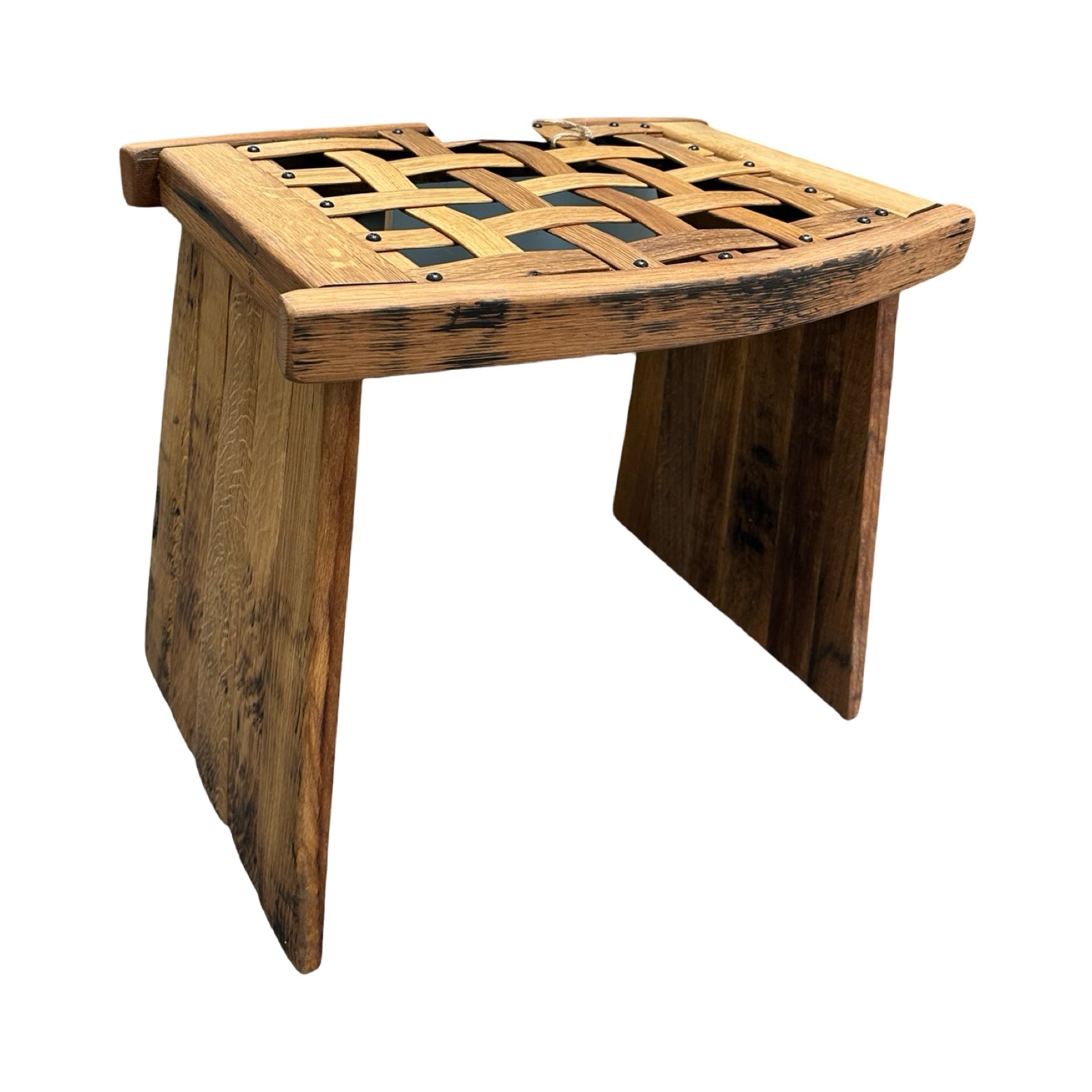 A wooden table with two solid panel legs and a woven lattice wooden top.