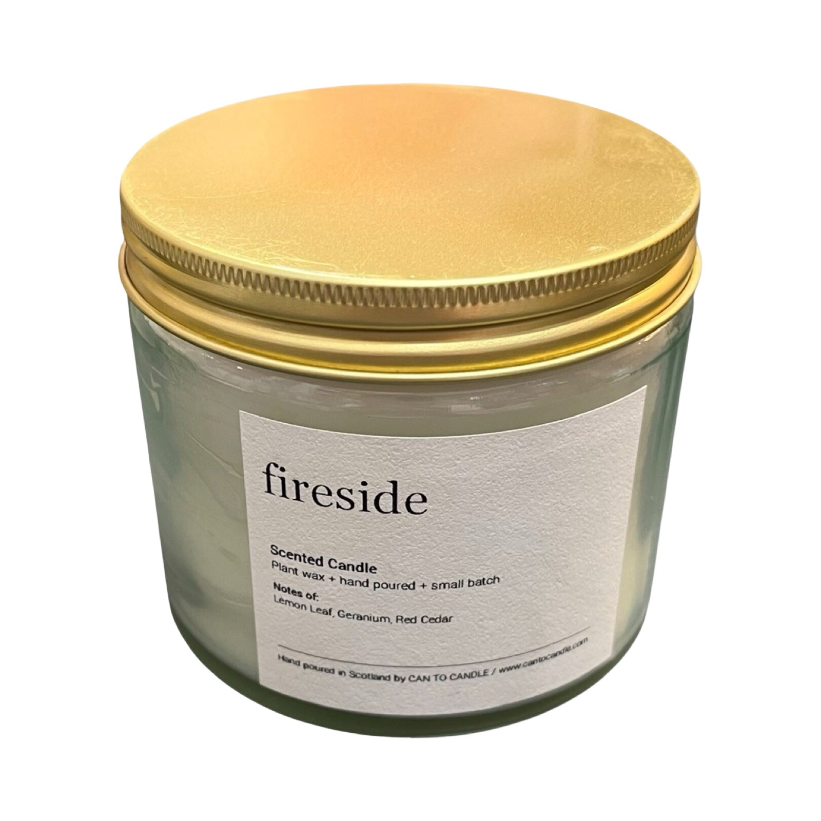 Scented candle labeled 'fireside' with a gold lid on a white background.