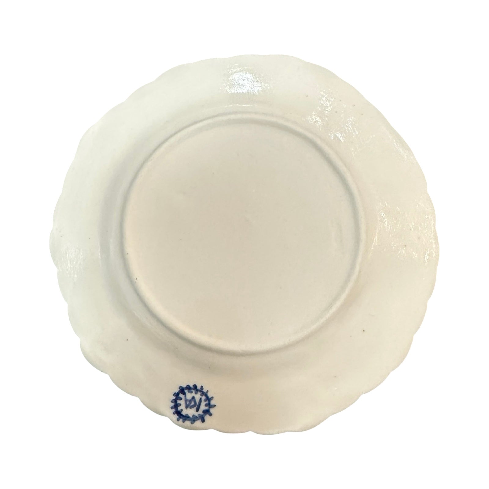 White ceramic plate with blue decorative element on a white background.