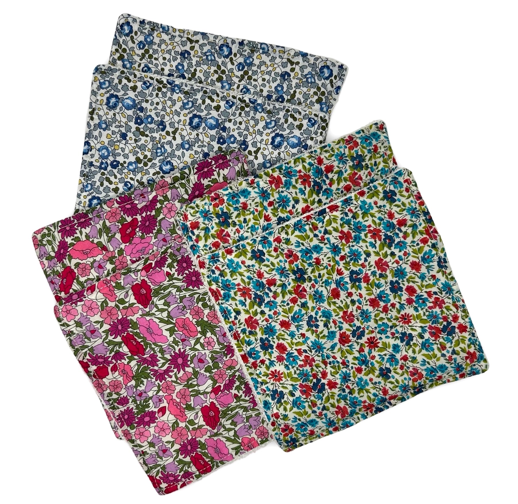 Six floral Liberty print face cloths in three different coloured floral patterns.