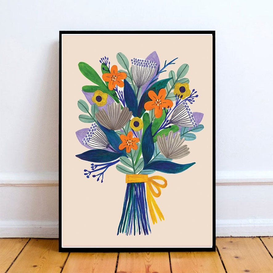 Framed artwork of a colourful bouquet of flowers on a beige background.