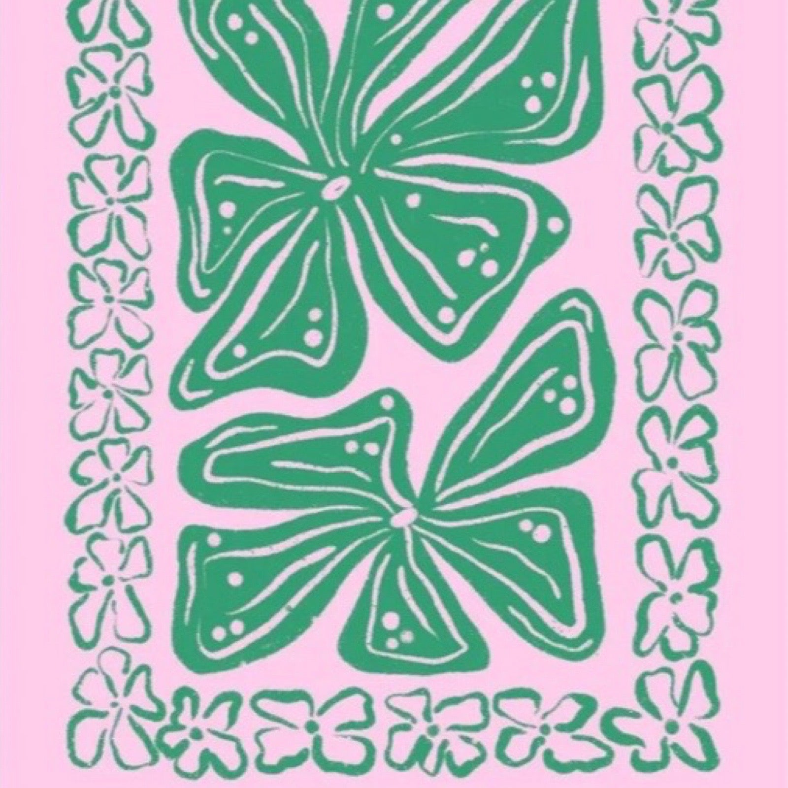This colourful rectangular print features green leaves in the centre surrounded by a green leaf border against a pink background.