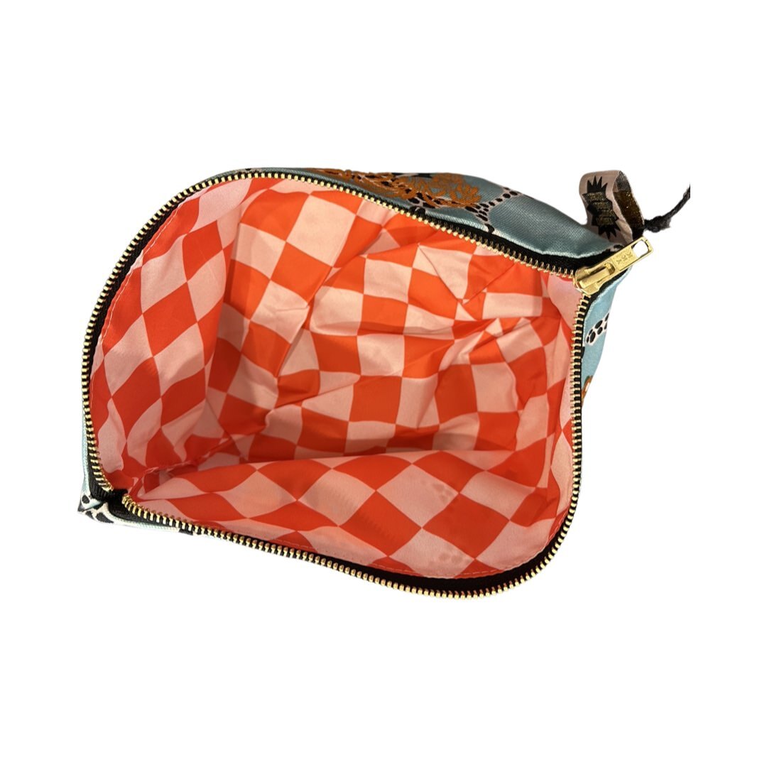 Red and pink checked waterproof inside of the flower market zip pouch.