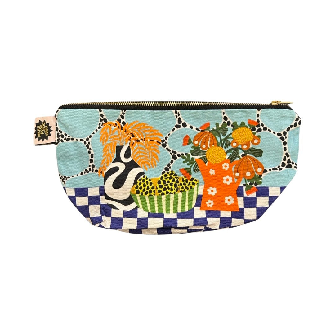 Large zip pouch in fabulous flower market fabric featuring a black and white vase with orange leaves, a red jug with white daisies full of colourful flowers and a blue and white checked base.