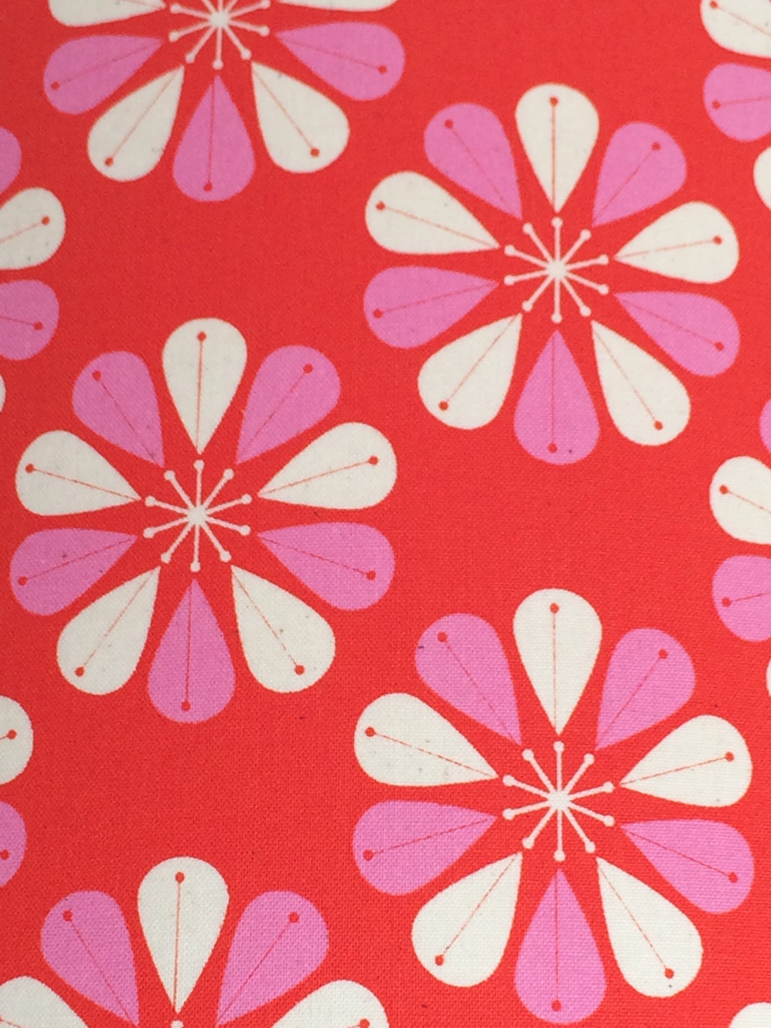 Red fabric with pink and white fowers