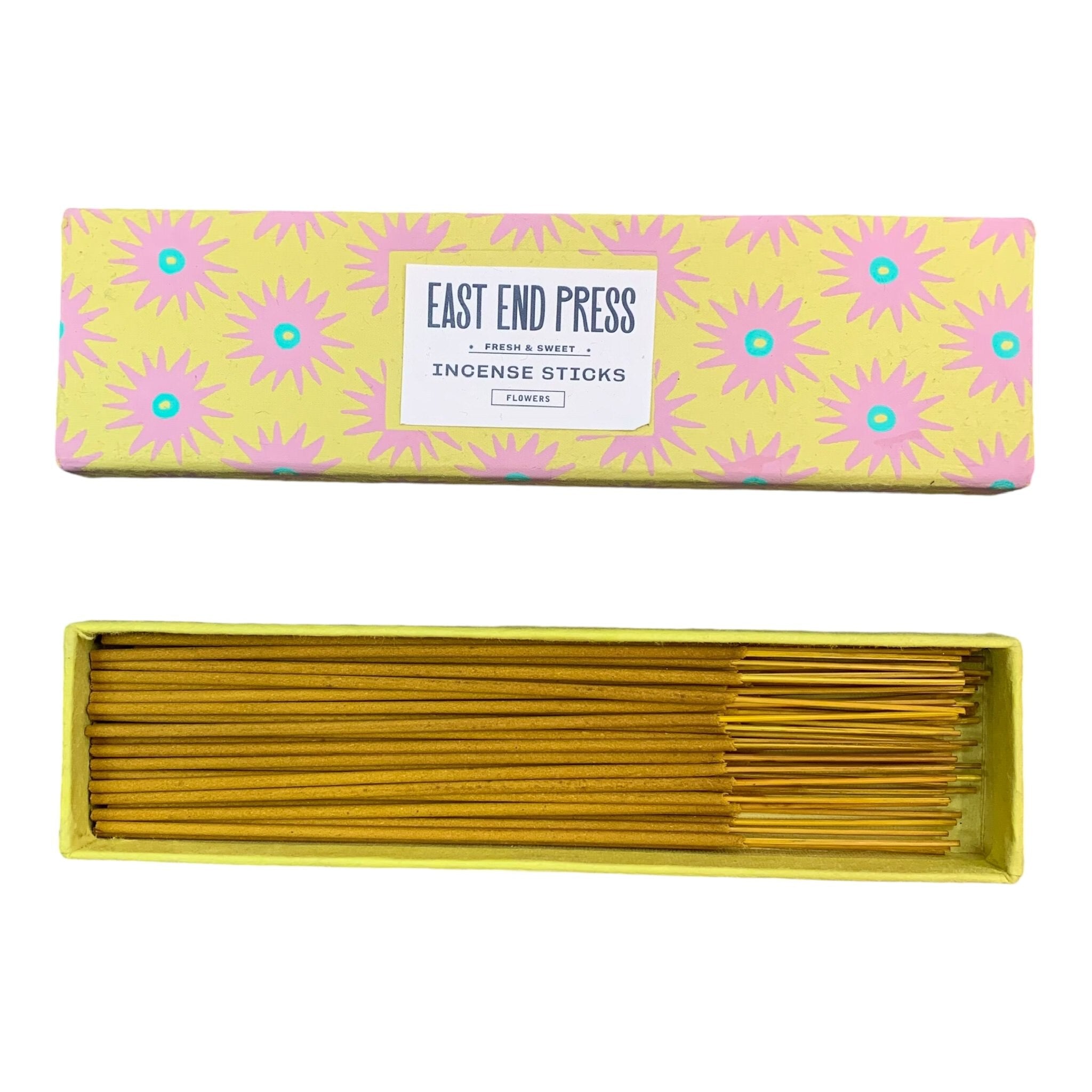 Yellow flowers scented incense sticks in a yellow box with pink flowers.