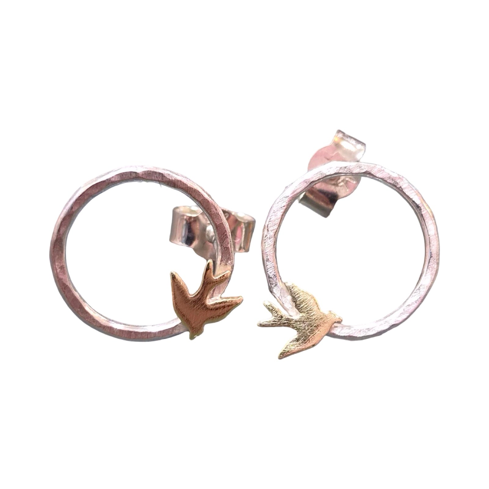 Pair of silver hoop earrings with bird designs on a white background.