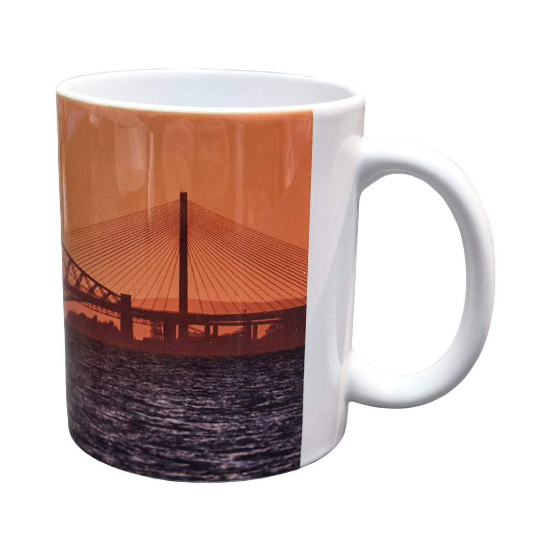 White mug with a bridge design on an orange background