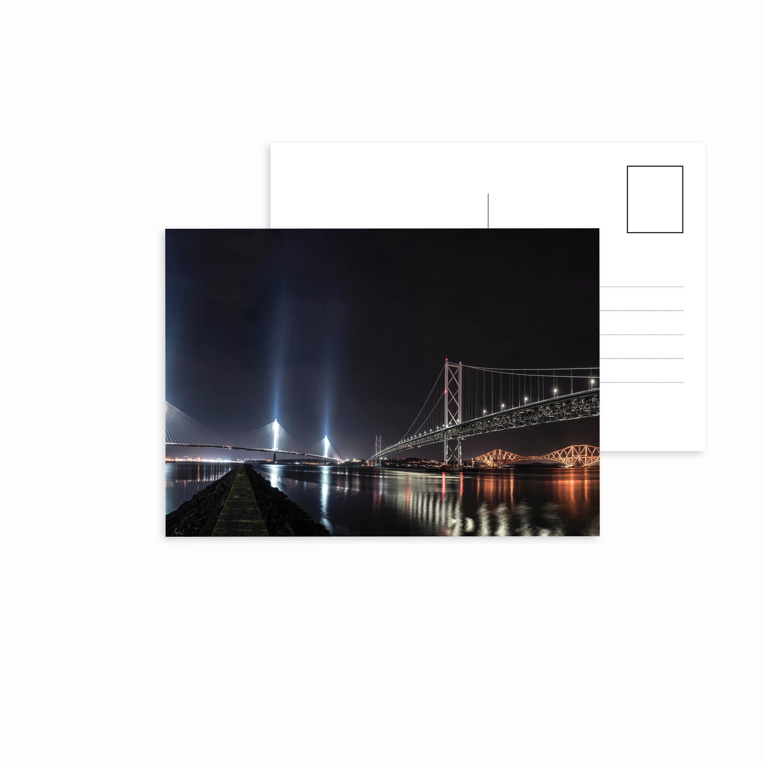 An image of the three bridges of the Forth, featuring the Queensferry Crossing, Forth Road Bridge and Forth Bridge on a postcard.