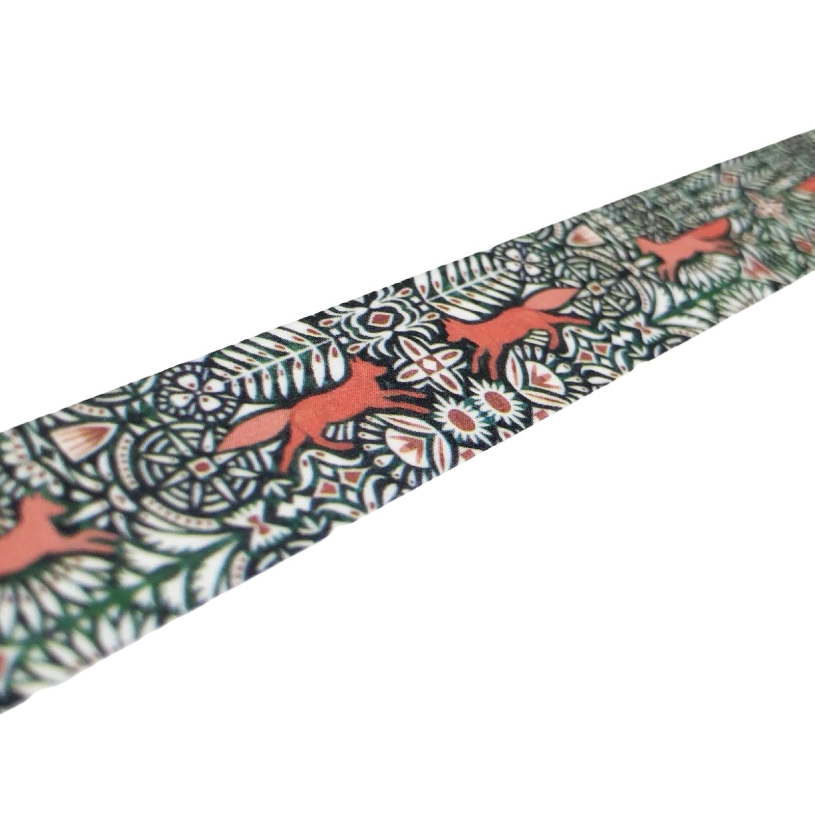 Patterned fabric strip with fox designs on a white background.