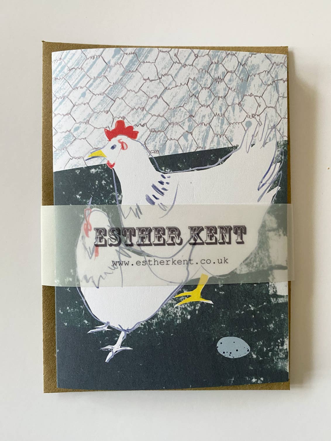 Card with a chicken illustration and 'Esther Kent' branding on a textured background.