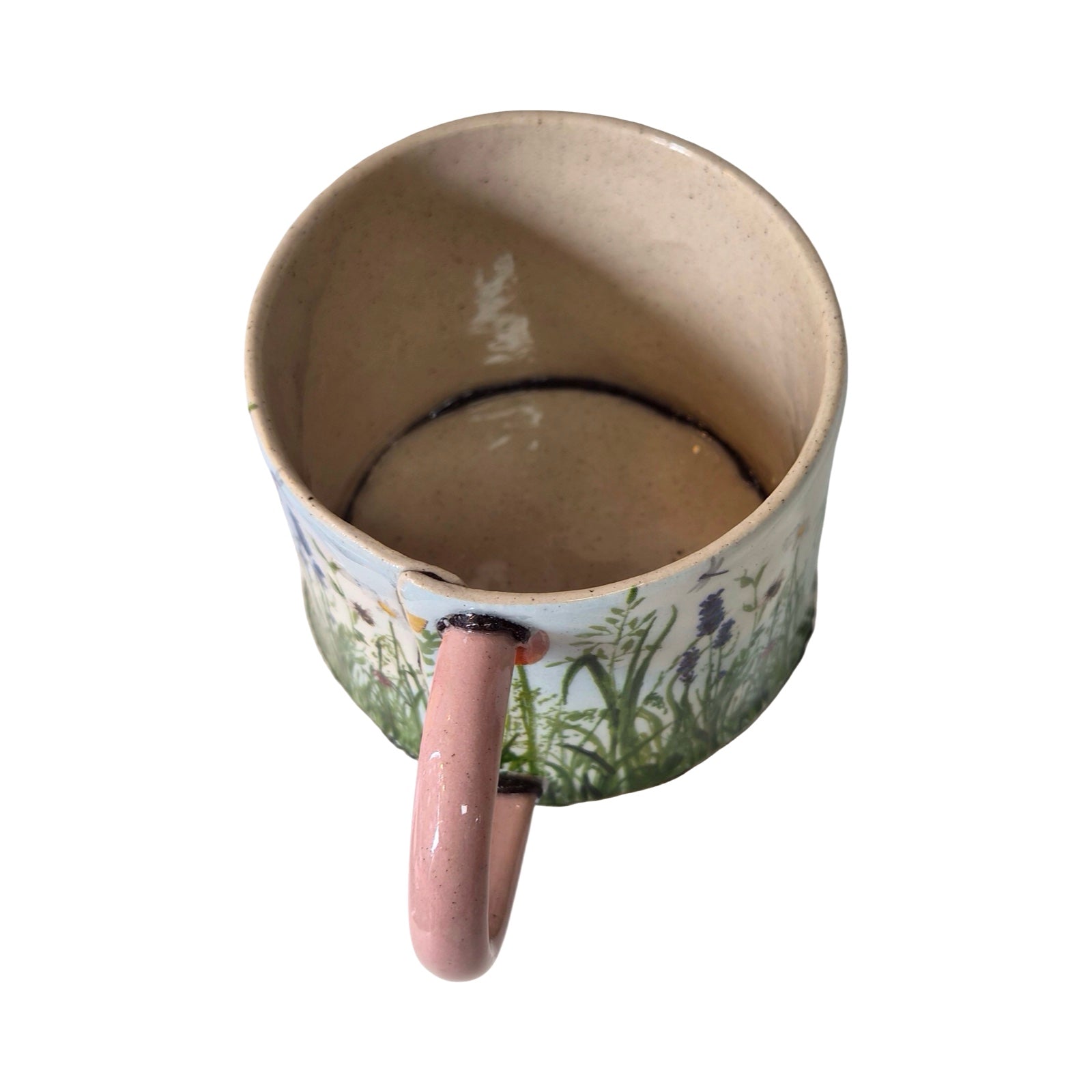 Ceramic mug with floral design on a white background.