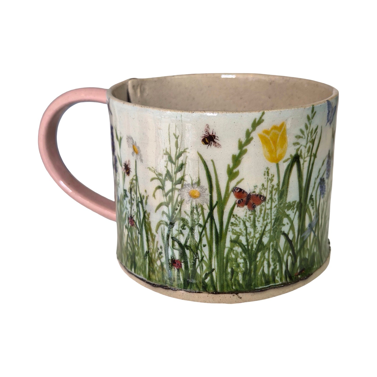 Mug with floral and insect design on a white background.