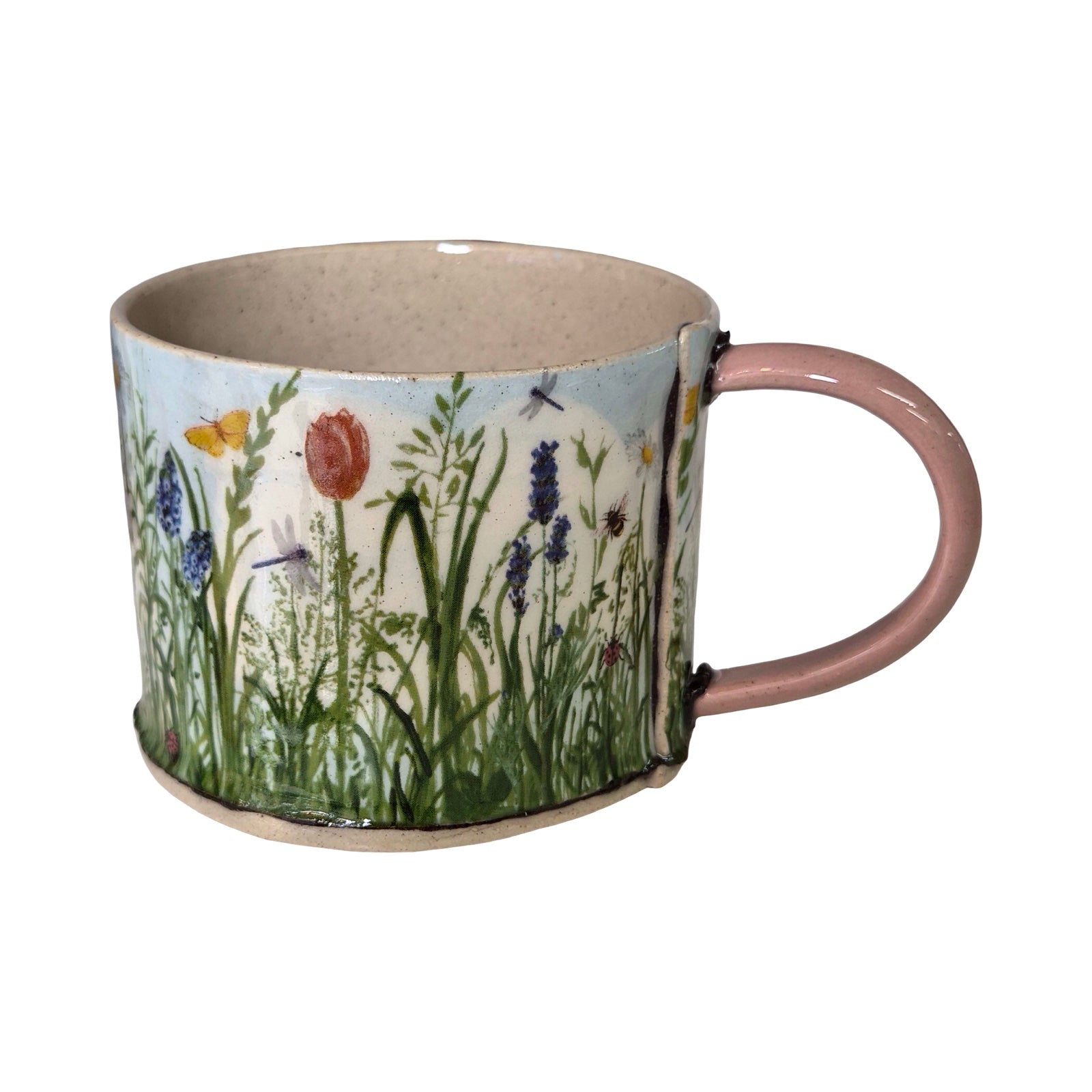 Ceramic mug with floral design on a white background,