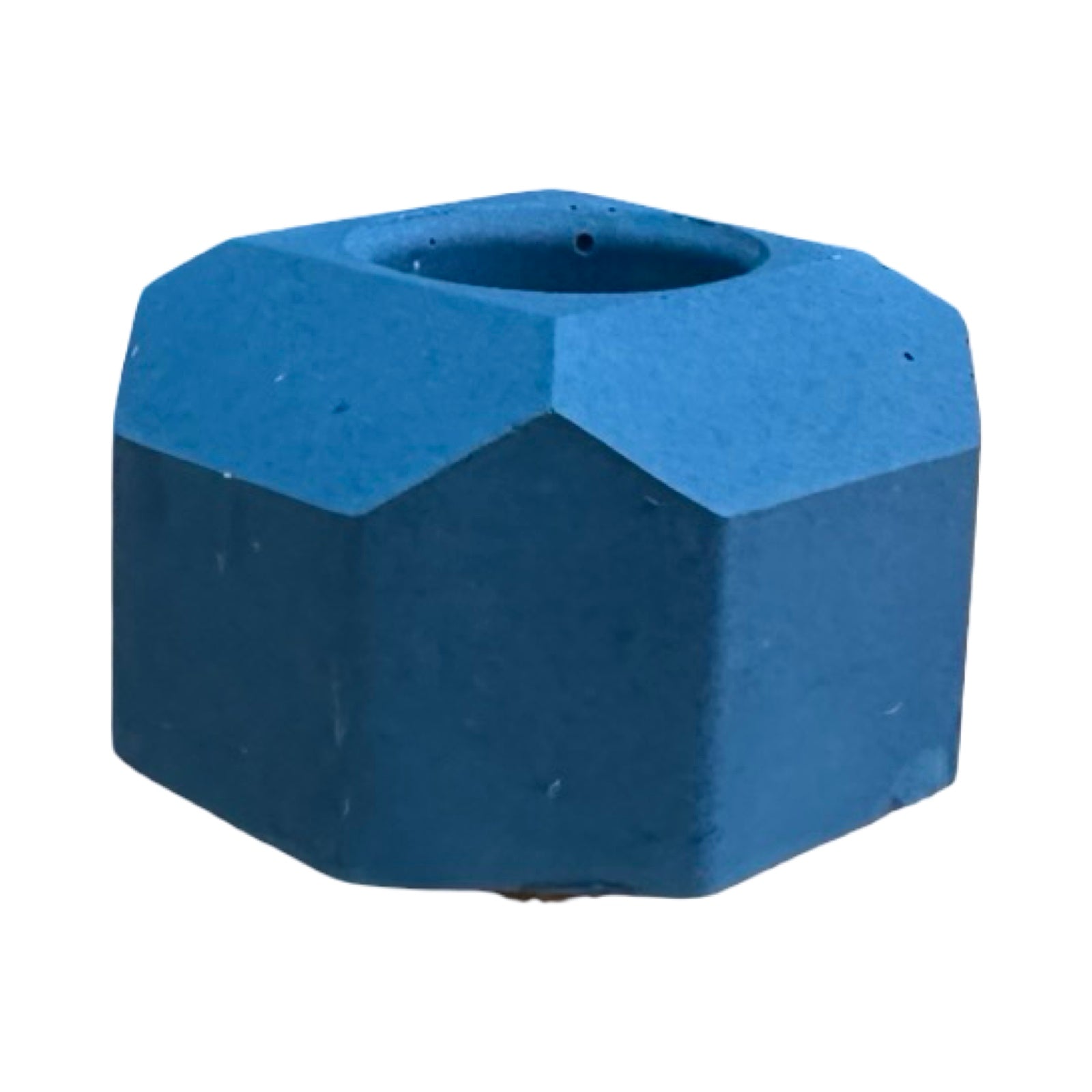 The side of a small geometric shaped dinner candle holder in navy.