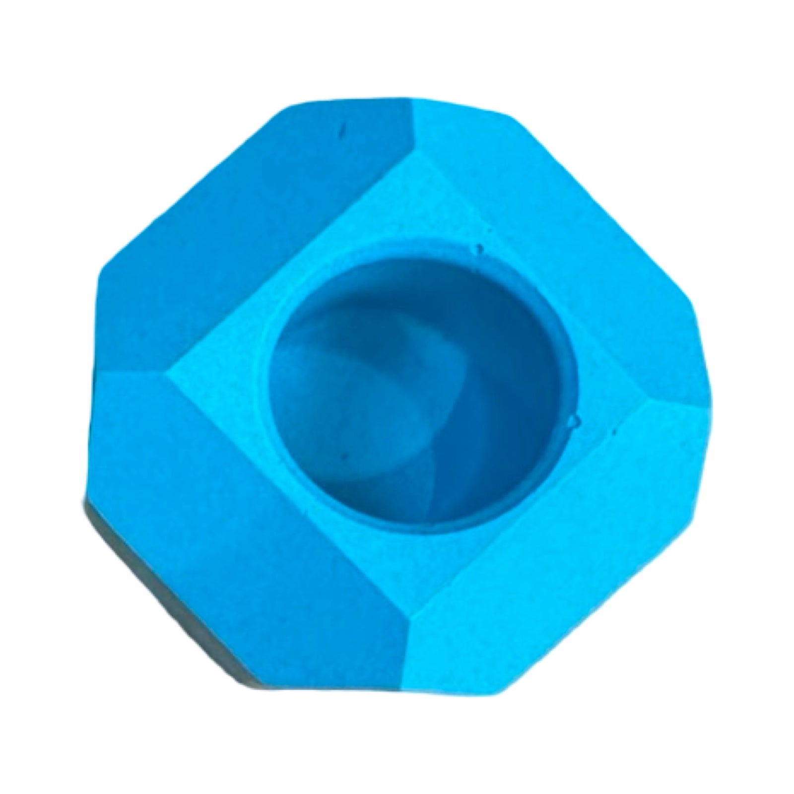 The top of a small geometric shaped dinner candle holder in turquoise.