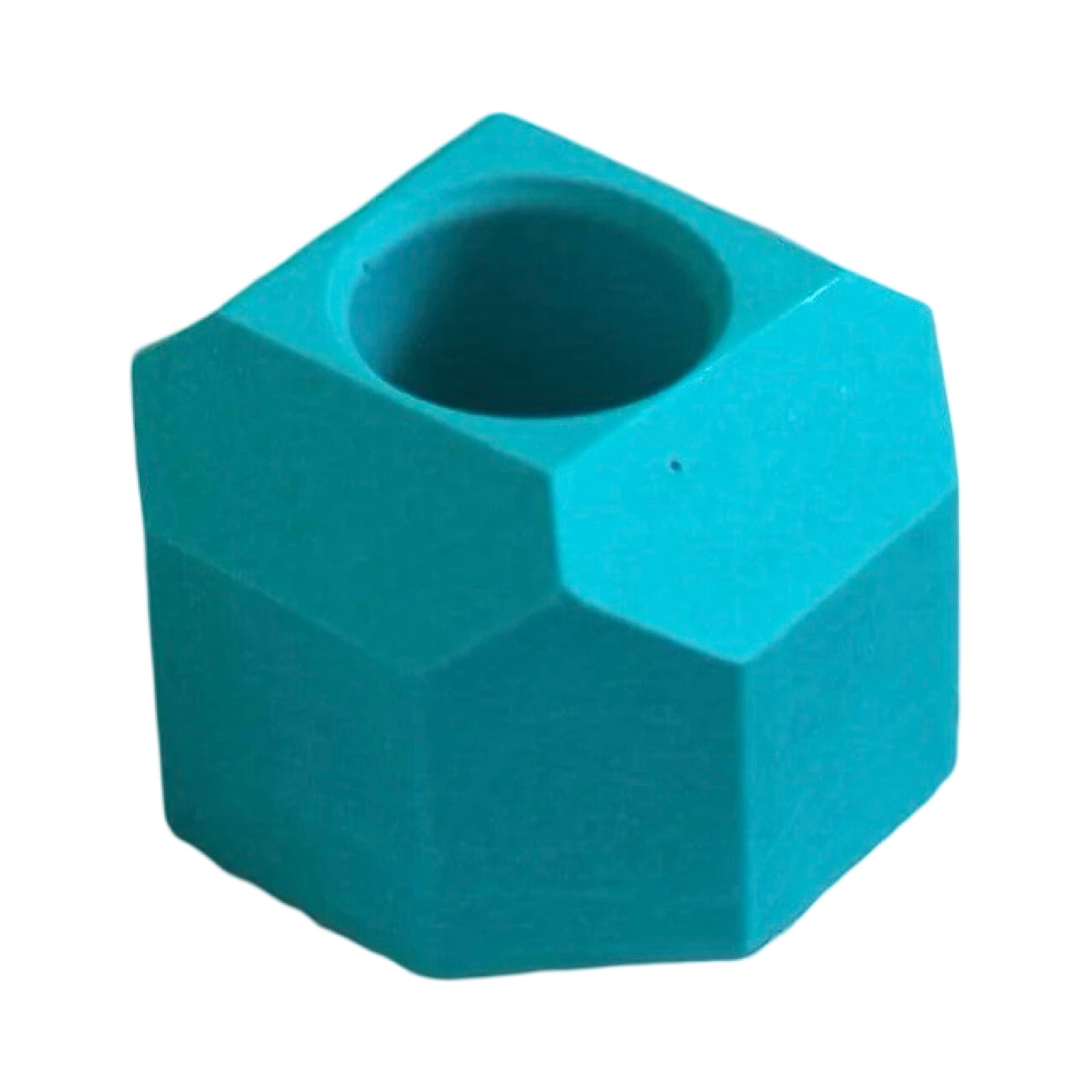 A small geometric shaped dinner candle holder in turquoise.