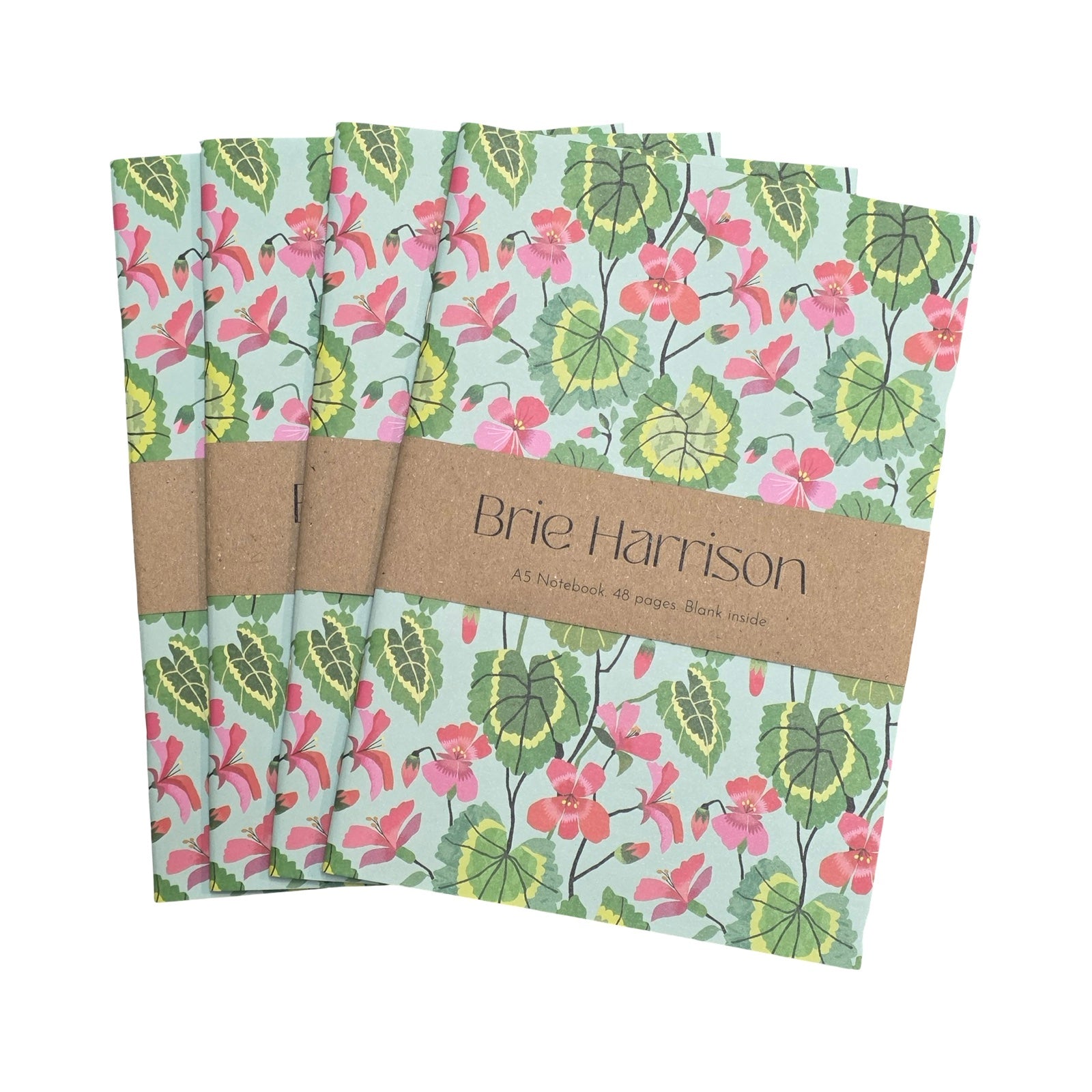 Set of four Brie Harrison floral notebooks with a brown band on a white background.