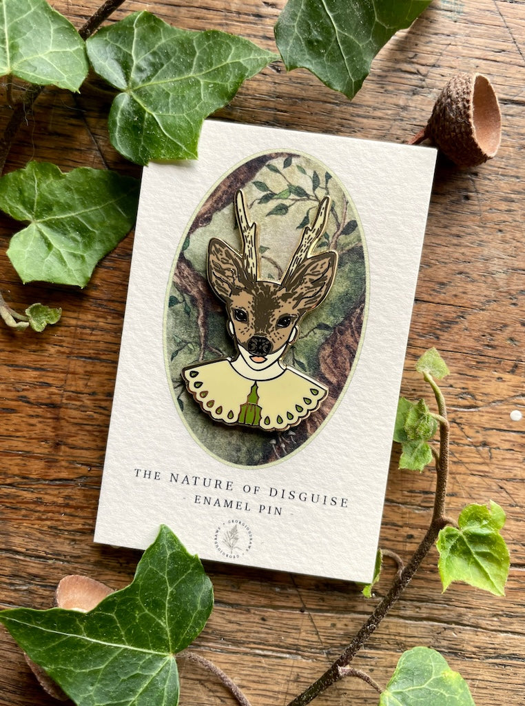 This enamel pin badge features a girl's head wearing a deer mask.