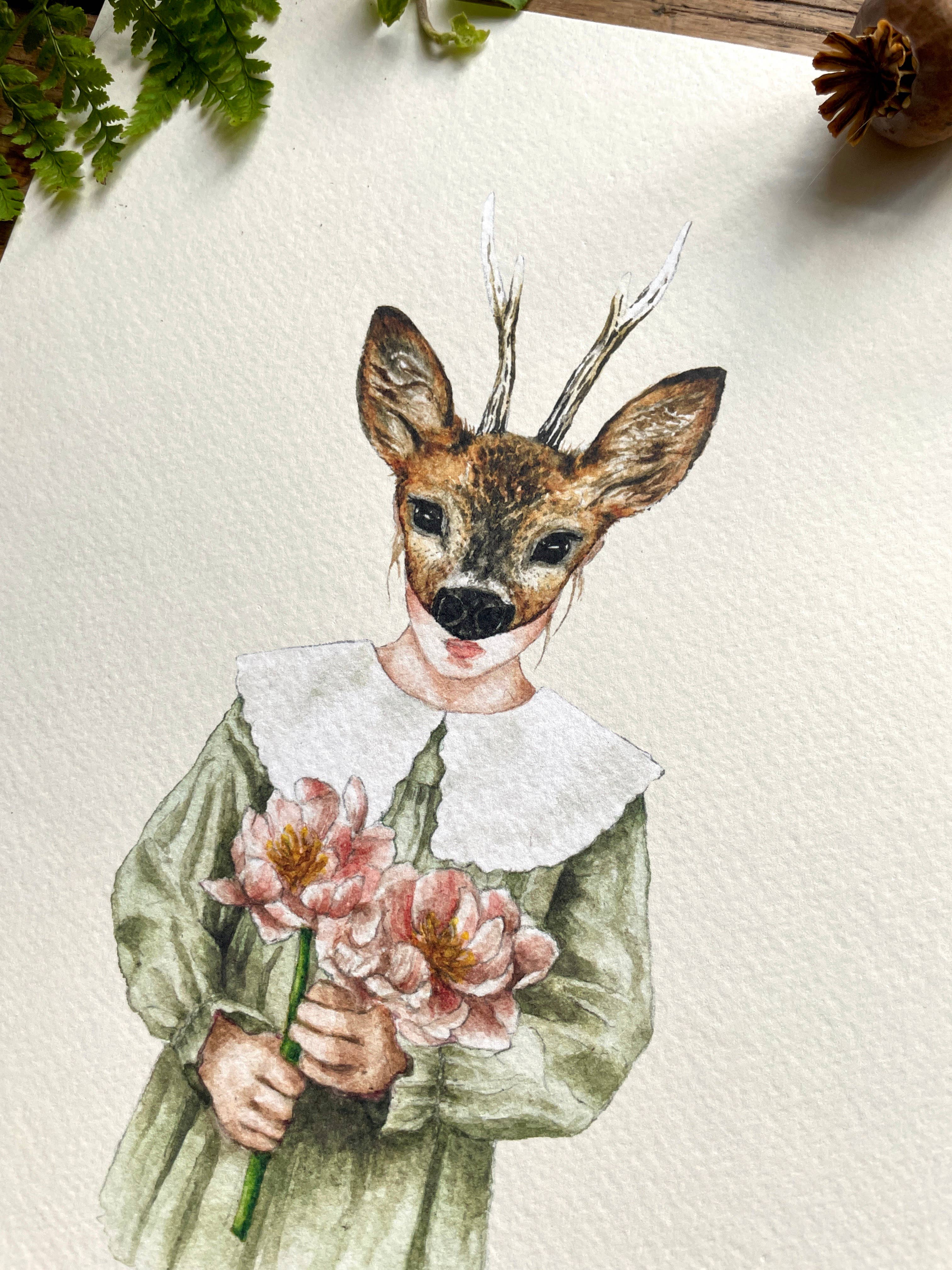 An art print of a girl wearing a deer mask, dressed in a green dress with a fabulous lace collar and holding a bunch of pink flowers.