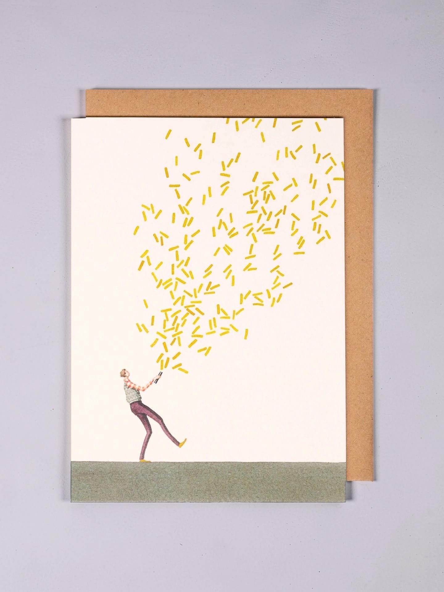 Greeting card with a person releasing yellow confetti on a plain background.