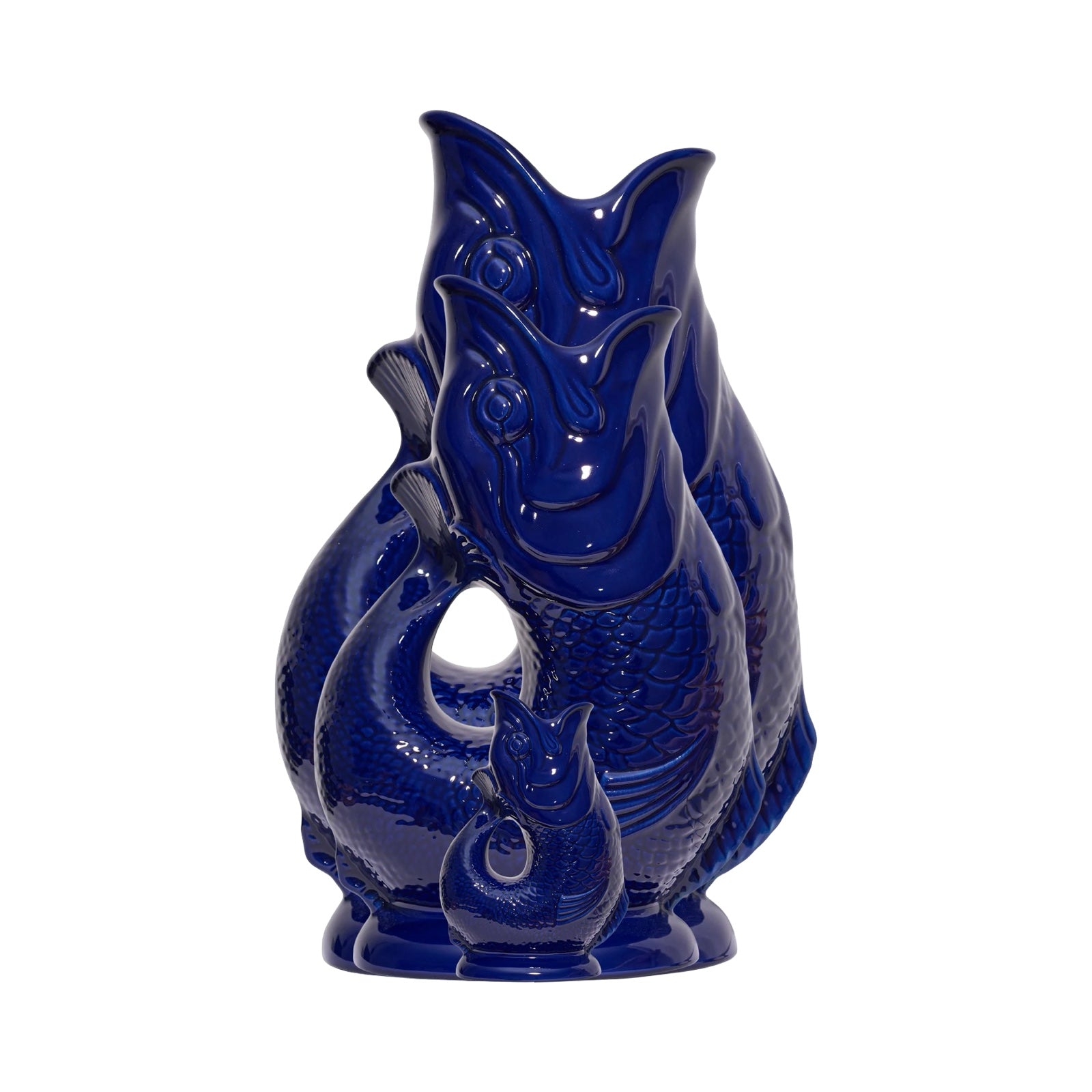 The side of a cobalt blue fish shaped gluggle jug.