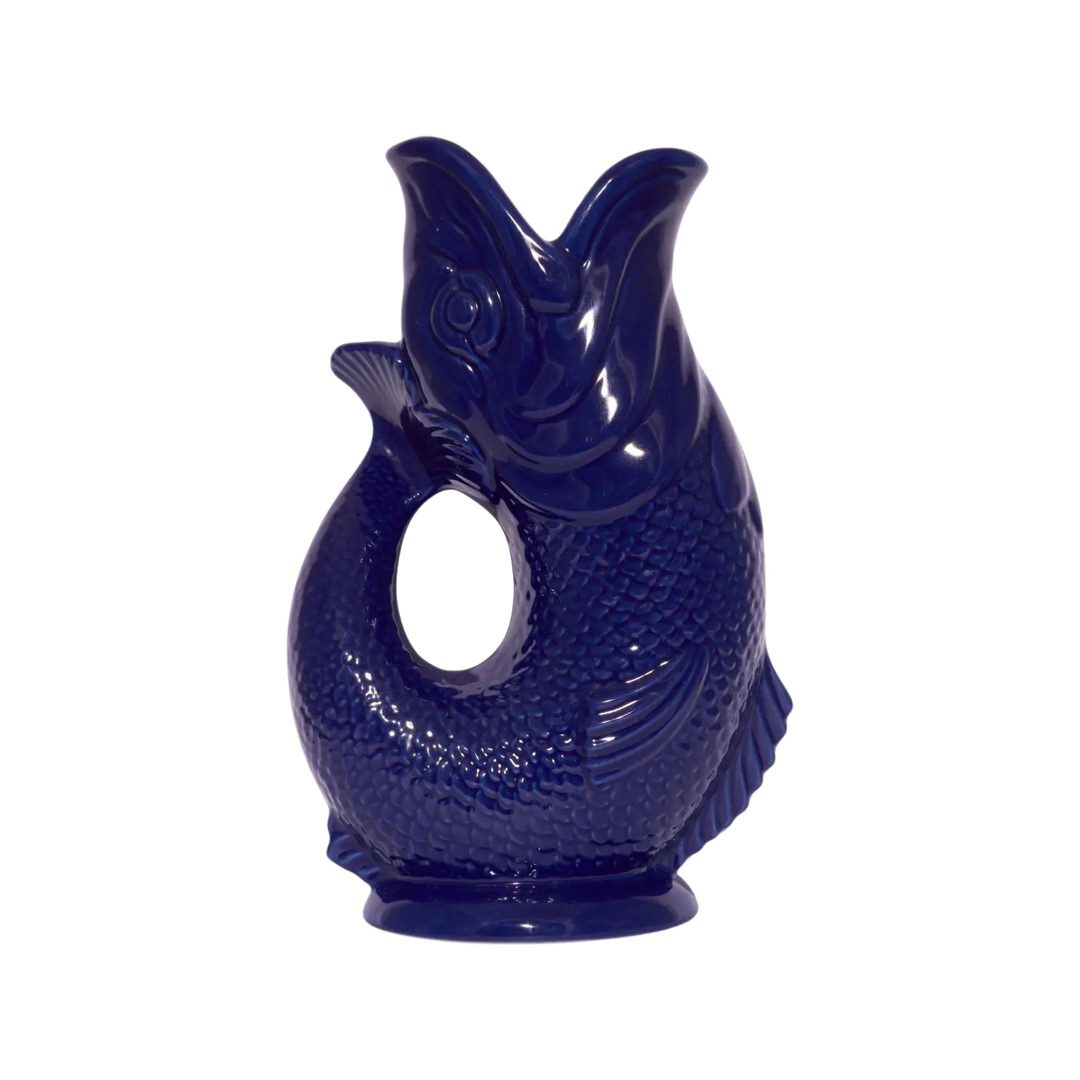 A cobalt blue fish shaped gluggle jug.