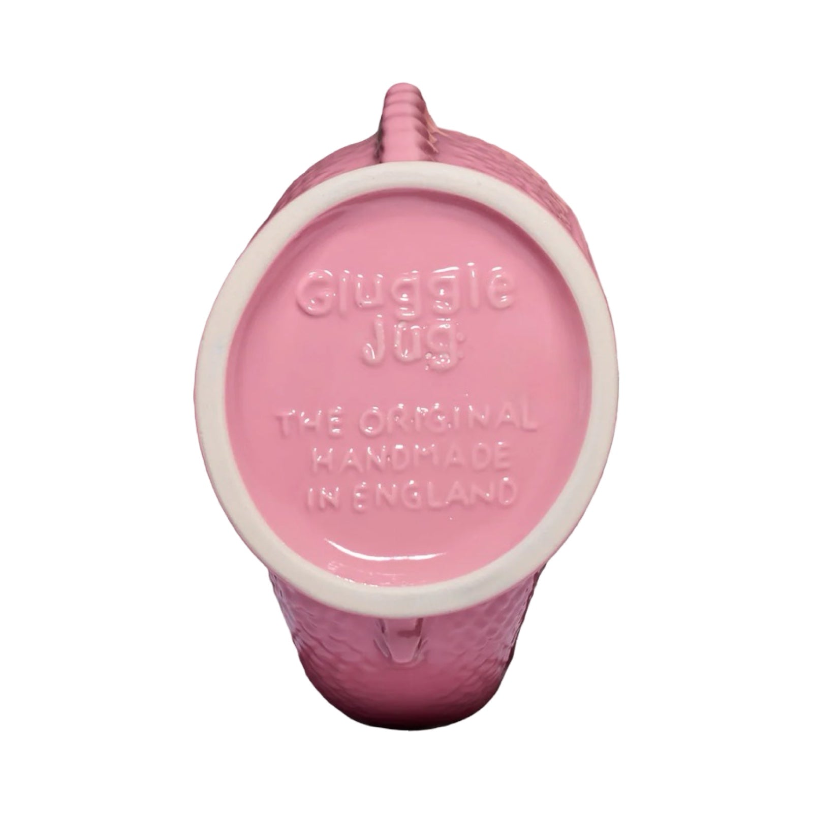 A pink fish shaped gluggle jug.