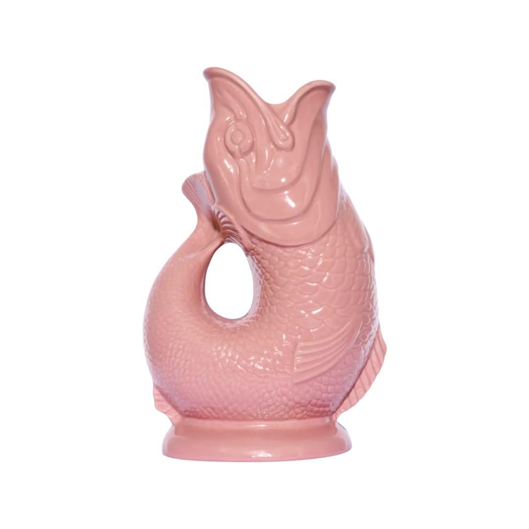 A pink fish shaped gluggle jug.